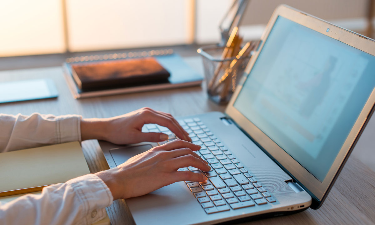 This is a photo of a person typing on the computer.